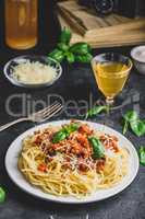 Spaghetti with bolognese sauce, parmesan and basil