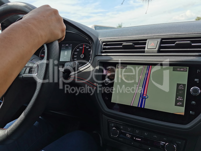 Driver in the car controls the navigator. Close-up part