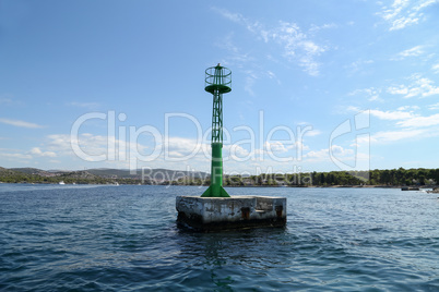 Lighthouse on the water indicates shallow water
