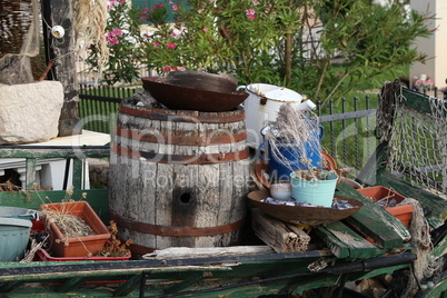 Old barrel, dishes and other junk used as decoration