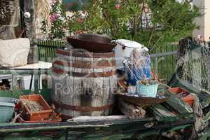 Old barrel, dishes and other junk used as decoration