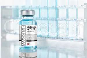 Coronavirus COVID-19 Vaccine Vial Near Test Tubes On Reflective