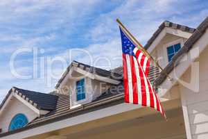American Flag Hanging From House Facade