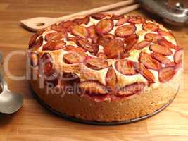 Delicious plum cake made from organic ingredients in a baking pl
