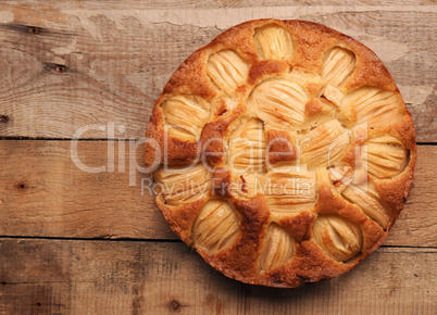 Delicious homemade organic apple pie on a rustic kitchen table,