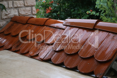 Red roof tiles laid on the grill oven