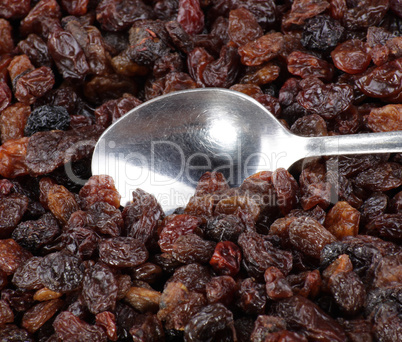 raisin background and teaspoon