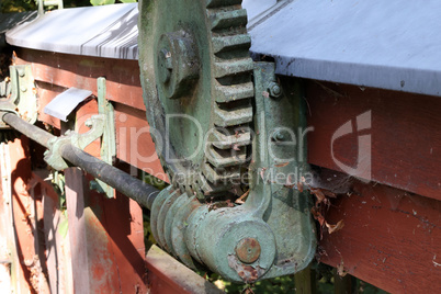 Old mechanism with a cogwheel and a worm gear.