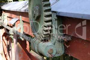 Old mechanism with a cogwheel and a worm gear.