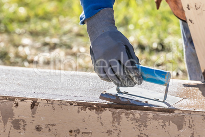 Construction Worker Using Hand Groover On Wet Cement Forming Cop