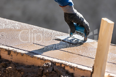 Construction Worker Using Hand Groover On Wet Cement Forming Cop