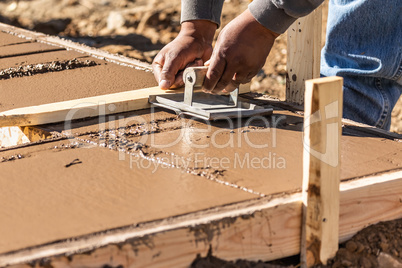 Construction Worker Using Hand Groover On Wet Cement Forming Cop