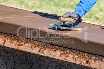 Construction Worker Using Hand Groover On Wet Cement Forming Cop