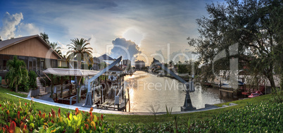 Boat lift in a waterway at sunset in Naples