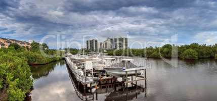 Boats docked in a harbor along the Cocohatchee River in Bonita S