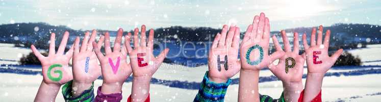 Children Hands Building Word Give Hope, Snowy Winter Background