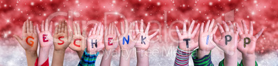 Children Hands Geschenktip Means Gift Tip, Red Christmas Background