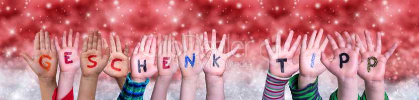 Children Hands Geschenktip Means Gift Tip, Red Christmas Background