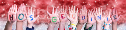 Children Hands Hos Geldiniz Means Welcome, Red Christmas Background