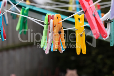 Close up of a colored clothespins on a clothesline