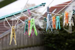 Close up of a colored clothespins on a clothesline