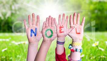 Children Hands Building Word Noel Means Christmas, Grass Meadow