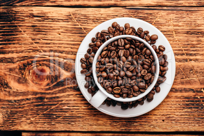 Cup full of roasted coffee beans