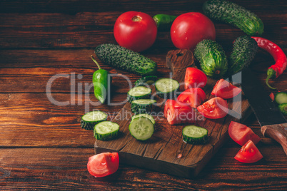 Sliced tomatoes, cucumbers and chili peppers
