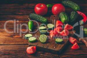 Sliced tomatoes, cucumbers and chili peppers
