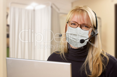 Woman At Medical Office Desk Wearing Face Mask