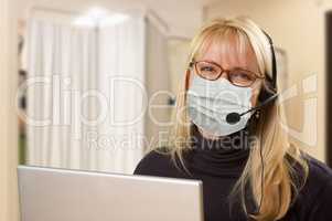 Woman At Medical Office Desk Wearing Face Mask
