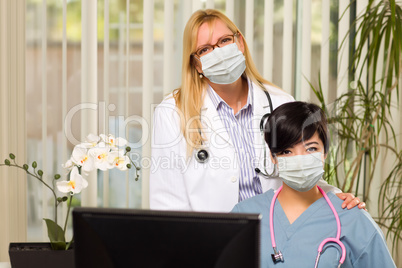 Doctor and Nurse At Office Desk Wearing Medical Face Masks