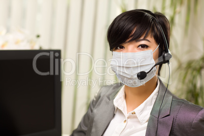 Woman At Office Desk Wearing Medical Face Mask