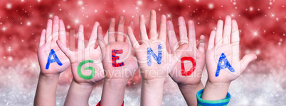 Children Hands Building Word Agenda, Red Christmas Background