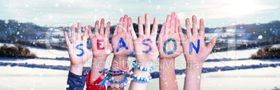 Children Hands Building Word Season, Snowy Winter Background