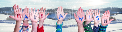 Children Hands Building Word Make A Wish, Snowy Winter Background