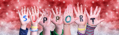 Children Hands Building Word Support, Red Christmas Background