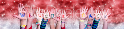 Children Hands Building Word Welcome Back, Red Christmas Background