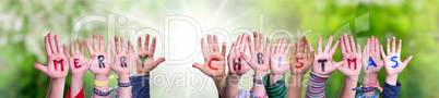 Children Hands Building Word Merry Christmas, Grass Meadow