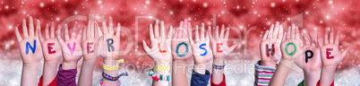 Children Hands Building Word Never Lose Hope, Red Christmas Background