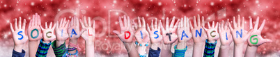 Children Hands Building Word Social Distancing, Red Christmas Background