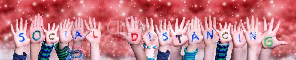 Children Hands Building Word Social Distancing, Red Christmas Background