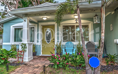 Blue and green beach bungalow porch in tropical Naples