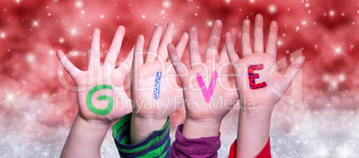 Children Hands Building Word Give, Red Christmas Background