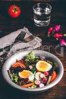 Fresh spring salad with homegrown vegetables and boiled eggs