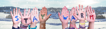 Children Hands Building Word Stay Warm, Snowy Winter Background