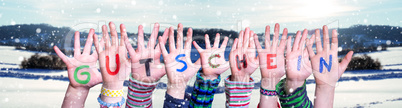 Children Hands Building Word Gutschein Means Voucher, Snowy Winter Background