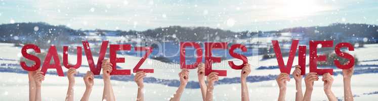 People Hands Holding Sauvez Des Vies Means Save Lives, Snowy Winter Background