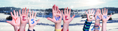 Children Hands Building Word Yes We Can, Snowy Winter Background