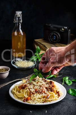 Spaghetti with bolognese sauce and grated parmesan cheese